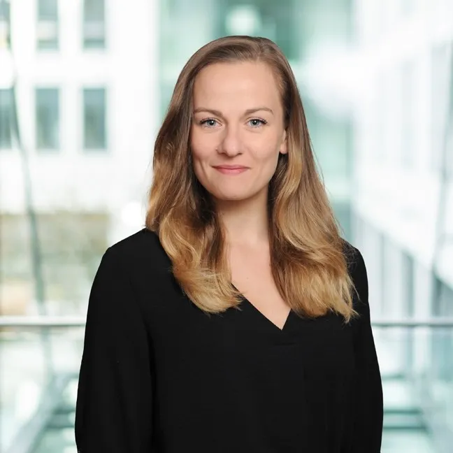 A smiling woman portrait in an office setting