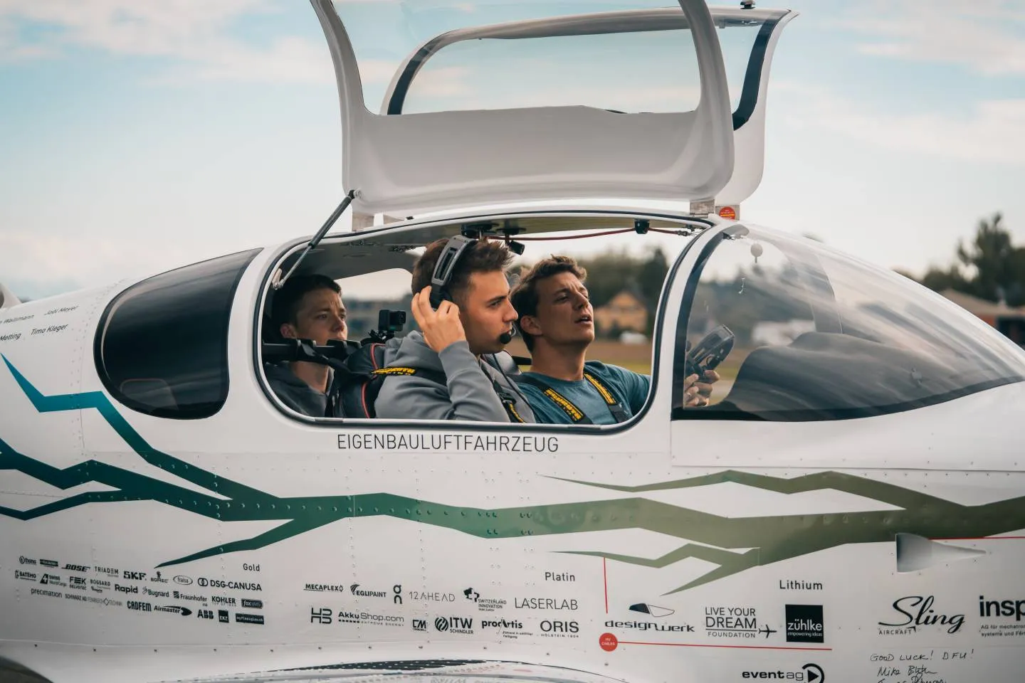 Three students in the plane preparing take off.