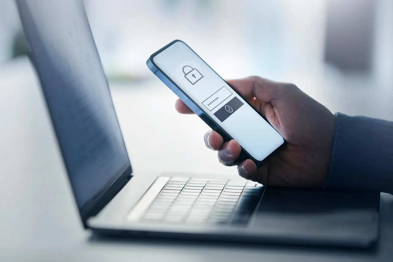 man-holding-smart-phone-with-data-security-on-display