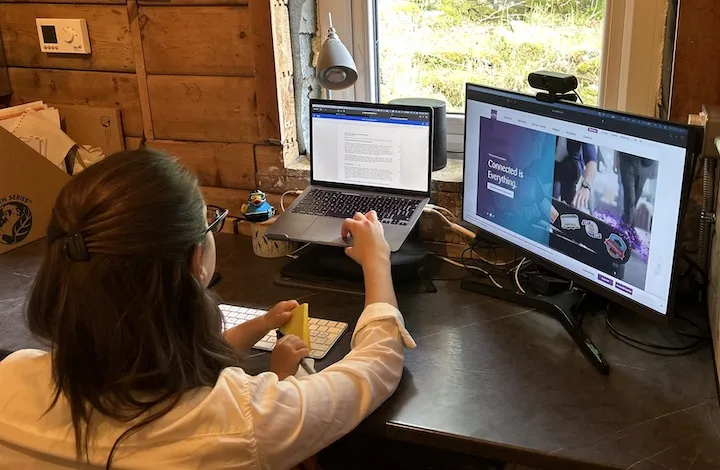 Chloe at her desk at the home office