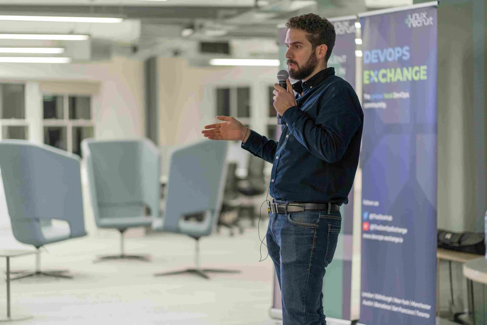 Raul hosting a meetup in Zühlke London noffice with the stylish office chairs in the background