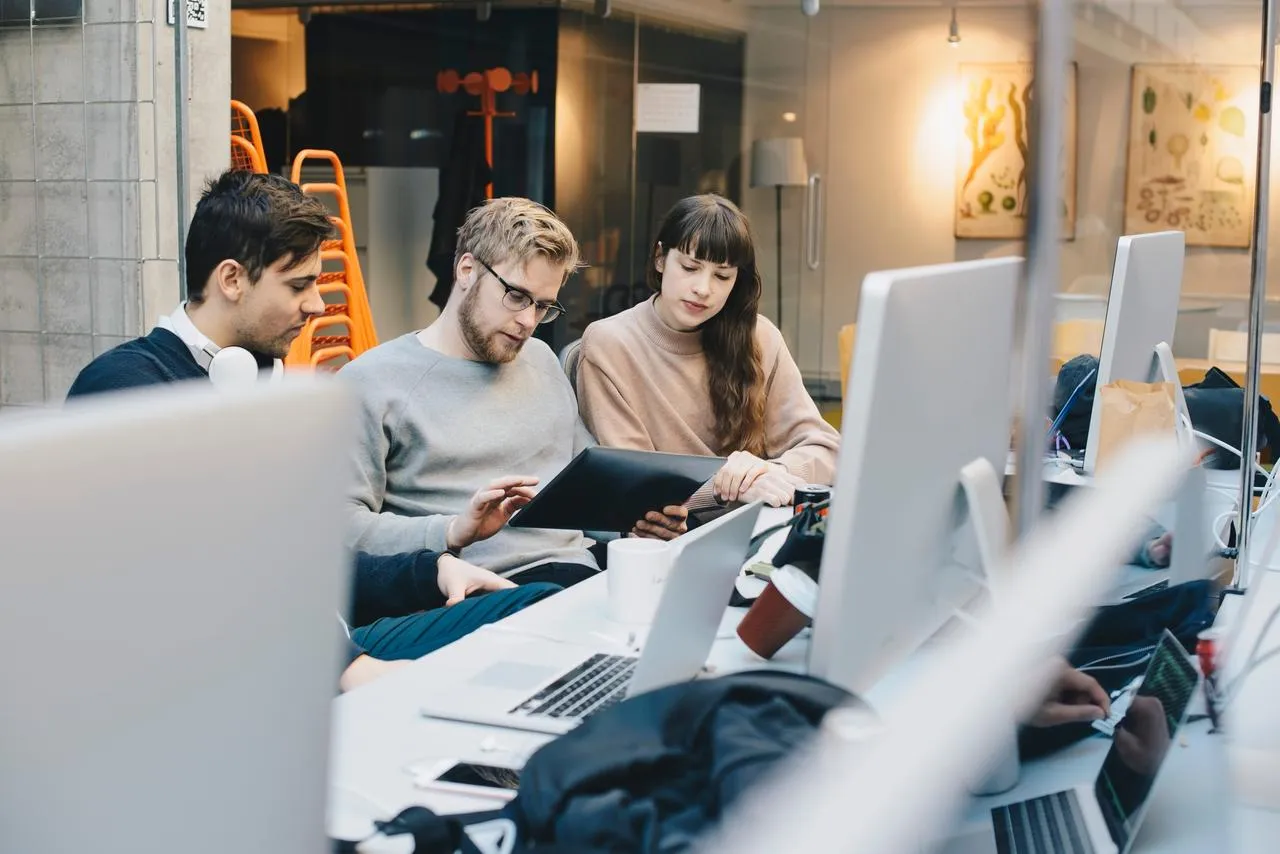 three engineers working on transforming retail systems