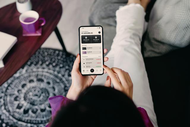 woman looking at a mobile banking app