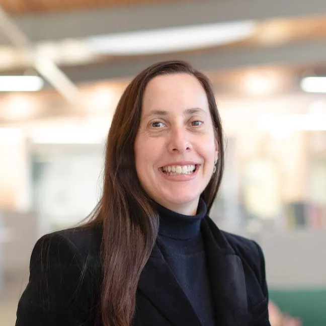 A smiling woman portrait in an office setting