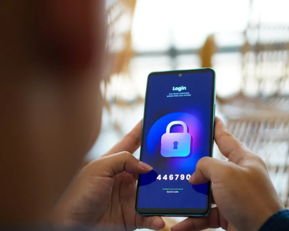 Person completing two factor authentication on mobile