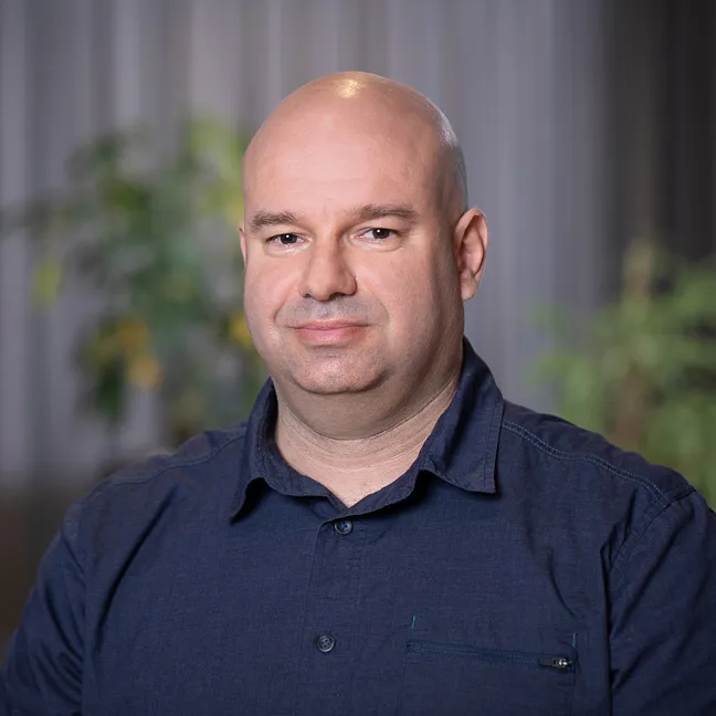 A man in a dark blue shirt