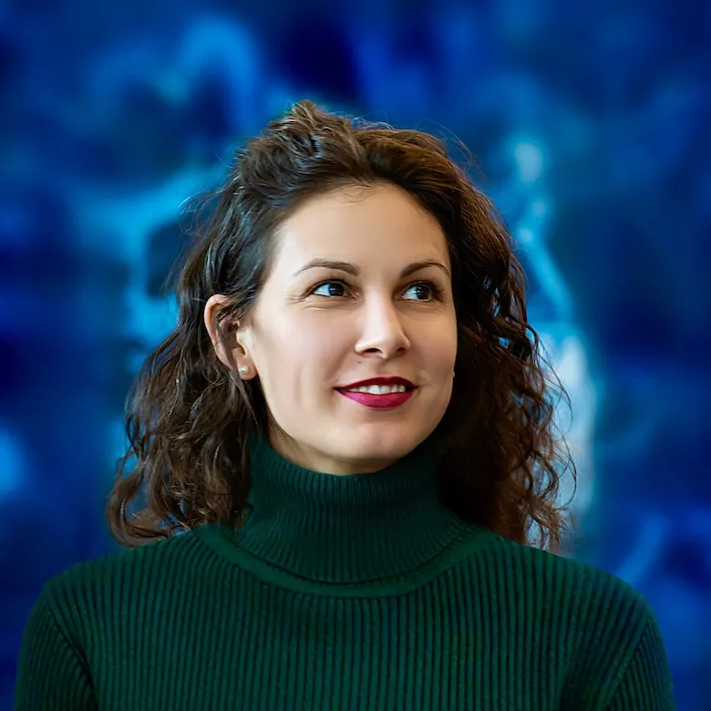 A smiling woman portrait on a abstract blue background