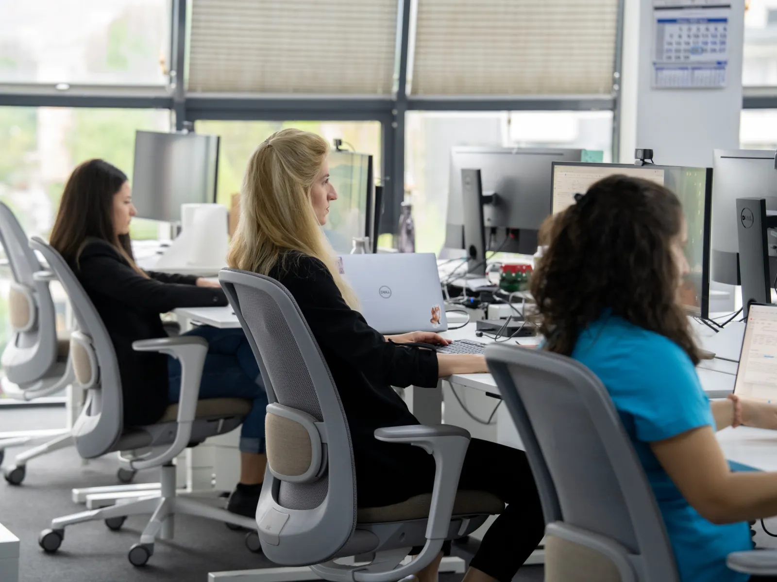 A group of women working at computers