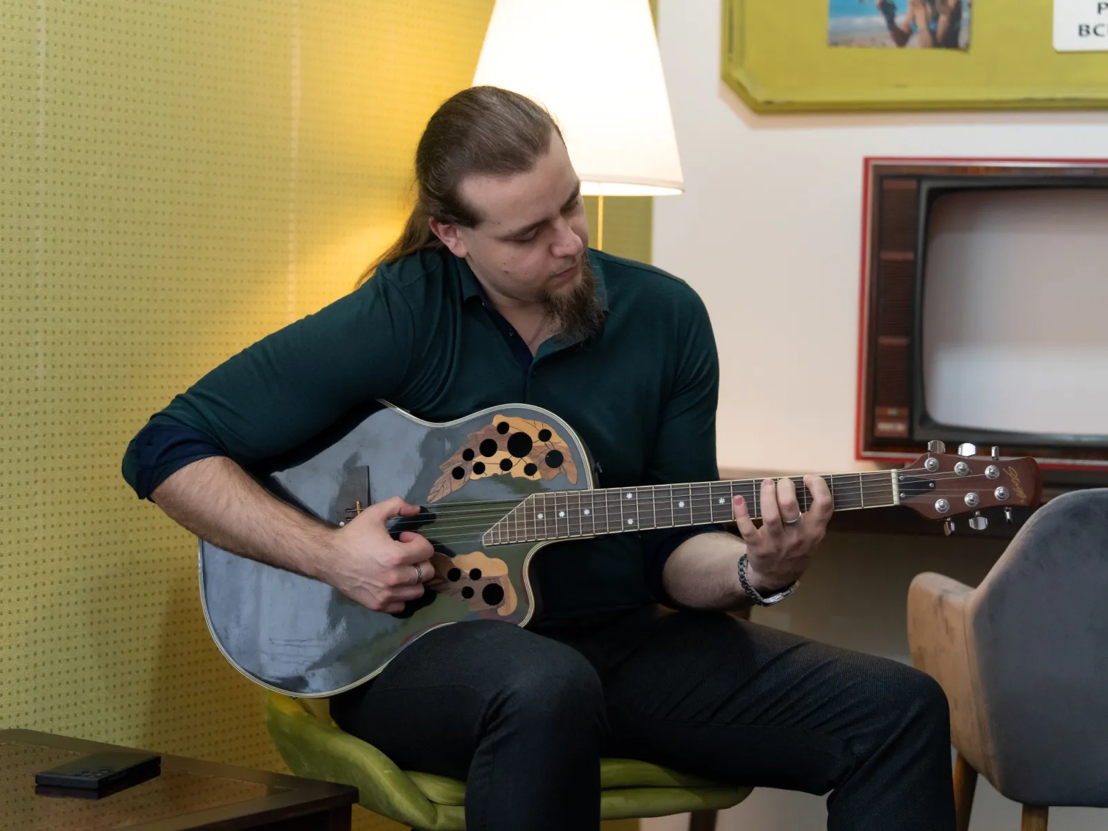 A man is playing a guitar