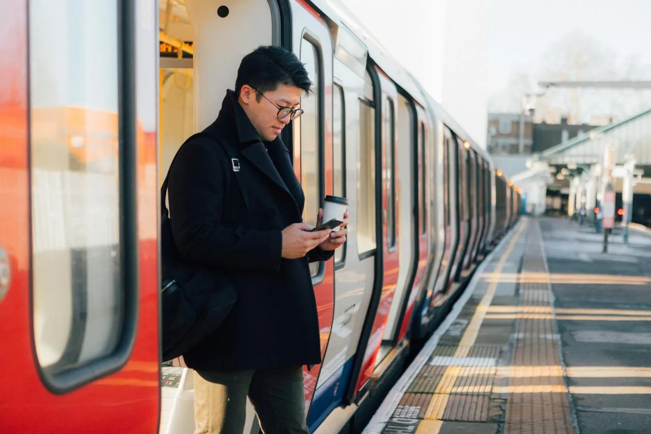 man exiting train