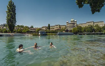 people swimming in the Aare river in Berne