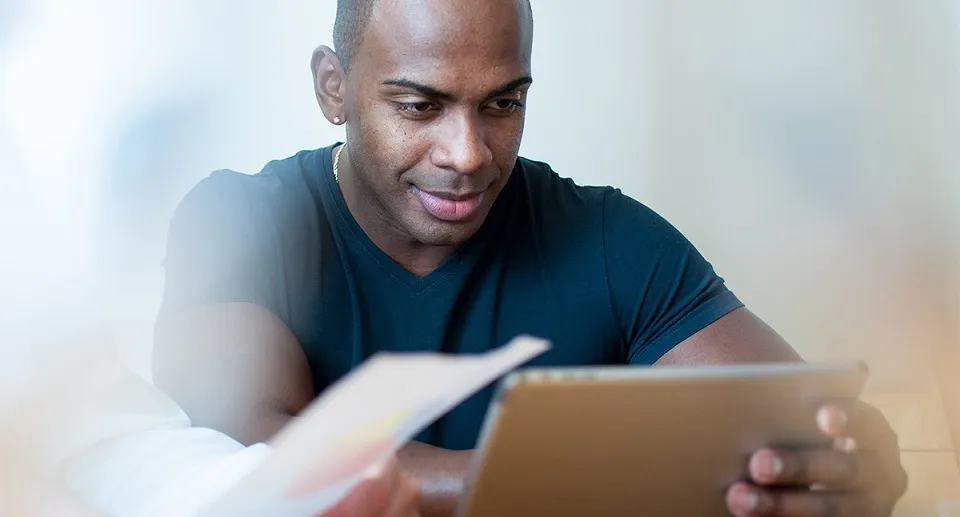 Man working on a tablet screen