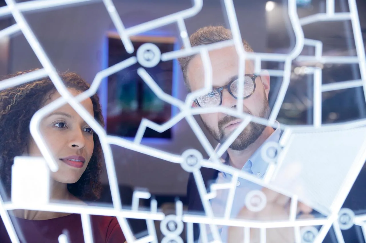 Two people researching registers of vulnerable customers